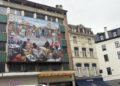 À Bruxelles, Matongé retrouve son emblème : la fresque de Chéri Samba renaît